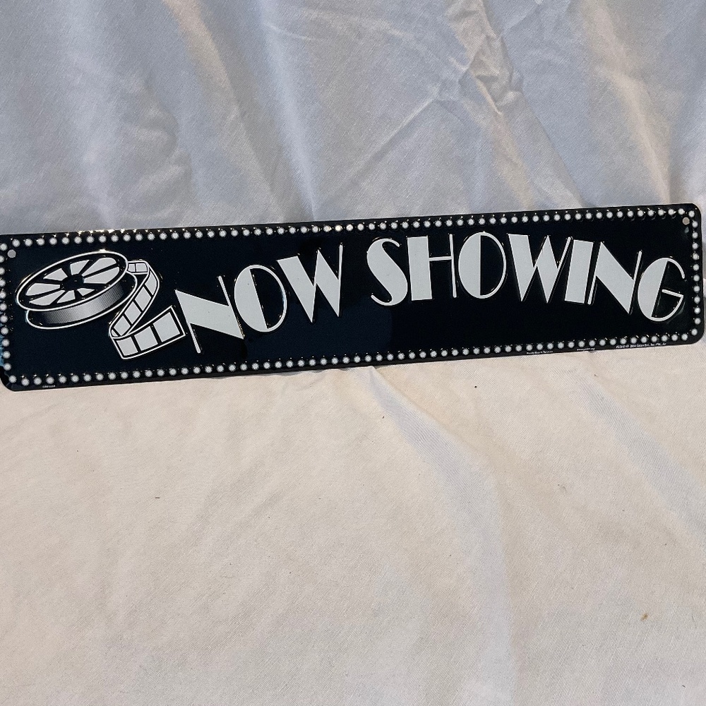Black & white metal movie sign - Now showing